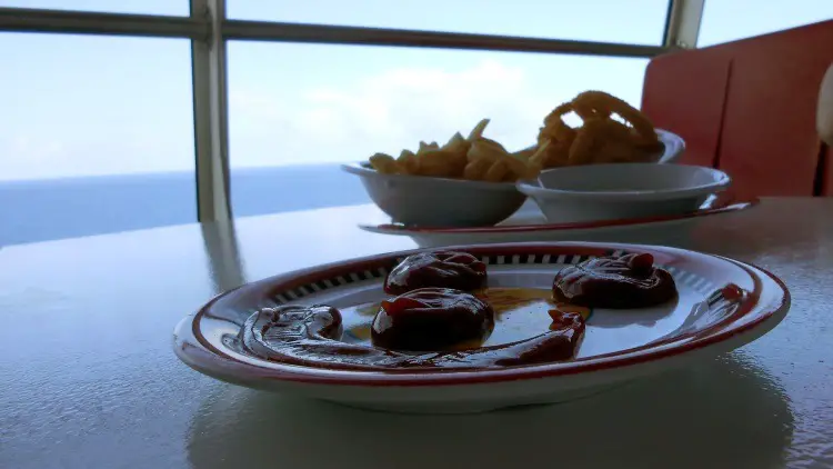 Enjoying french fries and onion rings at Jonny Rockets at sea!