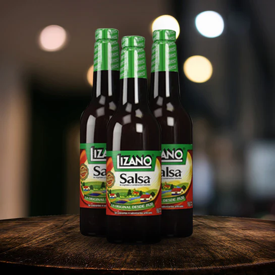 Bottle of brown Costa Rican sauce with green and white label - Lizano Salsa