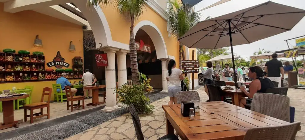 Port area restaurant with outdoor seating with umbrellas