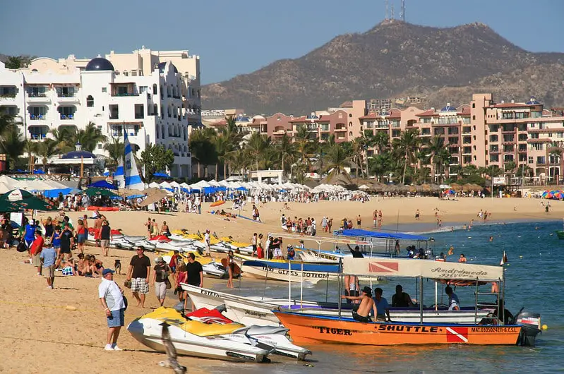 El Medano beach with people, boats and jet skis