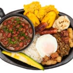 Plate with a bowl of red beans, rice, fried egg, plantain, ground meat