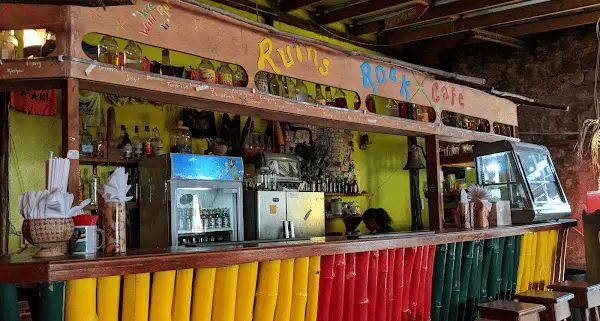 Colorful wooden bar inside the Ruins Rock Cafe with the cafe above the bar