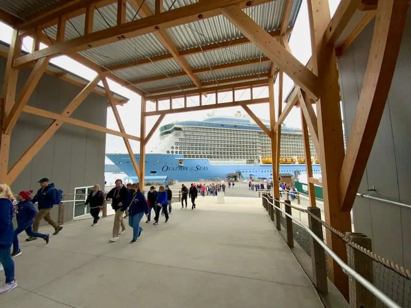 Cruise passengers walking from cruise ship docked in Sitka through new cruise terminal