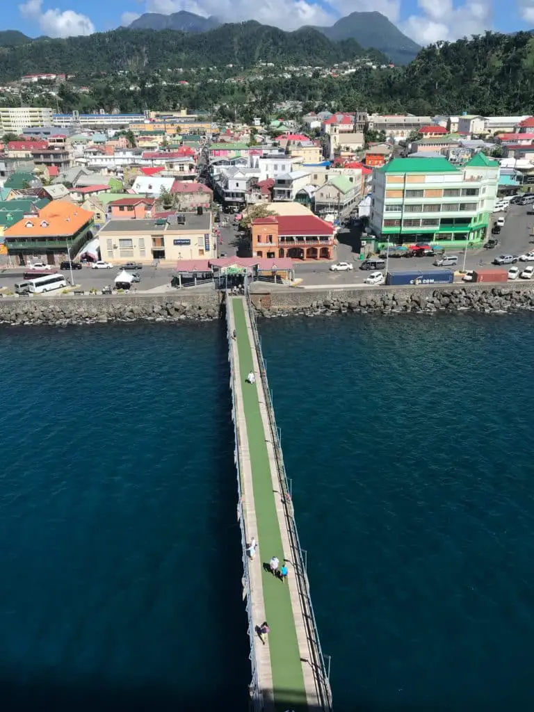 View from ship docked at Roseau pier showing length of pier to the town