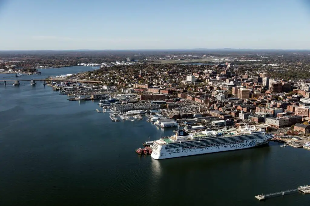 Aerial view of large cruise ship docked in Portland, Maine, right in the center of the city. 